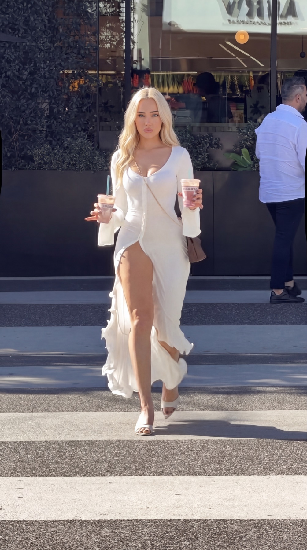 Viper Deme street style in a white maxi dress with iced coffee — Miami creator